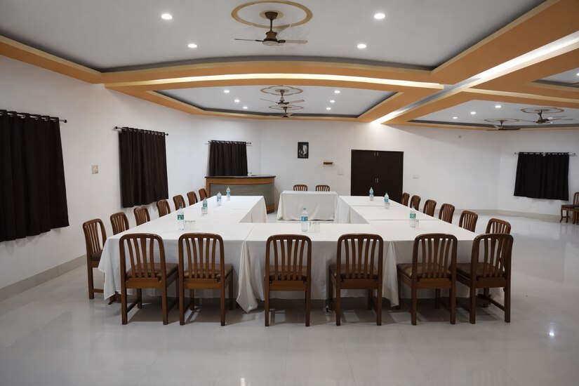 Conference room with U-shaped table setup at Nature's Lap Resort